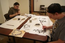 Students at a Chinese painting workshop.