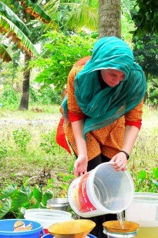 Woman filtering water.