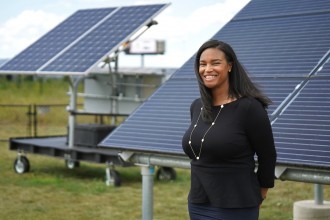 Dr. Brandy Brown stands by WMU's educational solar array.