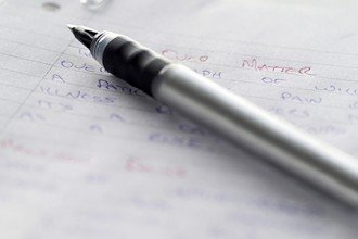 Photo of a pen on paper.