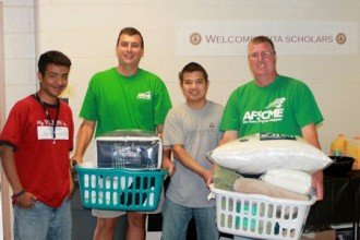 Photo of volunteers with Seita welcome pack donations.