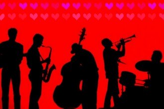 A silhouette of musicians playing various instruments under a pattern of small hearts.