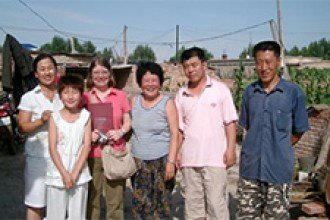 2013 grant winner and WMU Professor Dr. Ann Veeck (second from left) with a family in China.