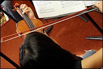 Photo of a student playing the violin.