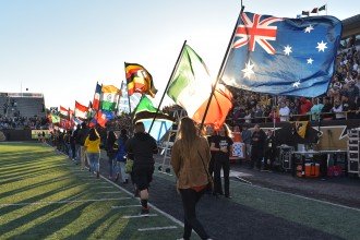 Photo of the homecoming football game's annual Parade of Flags.