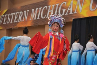 Chinese dance group performing a traditional Chinese dance in the WMU Recreation Center at the 2015 China Festival