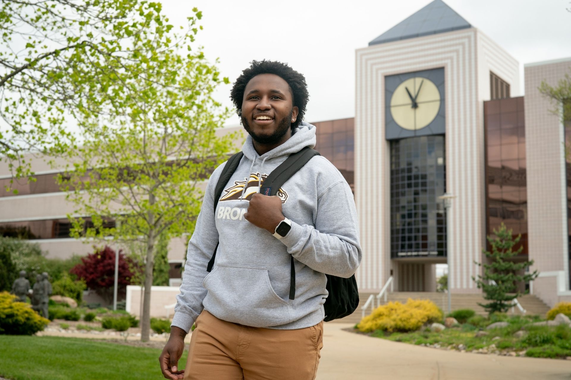 student in front of Waldo Library at Western Michigan University