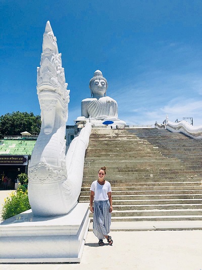 Erika Larsen Poses near a monument in Malaysia