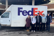 photo of students with FedEx truck