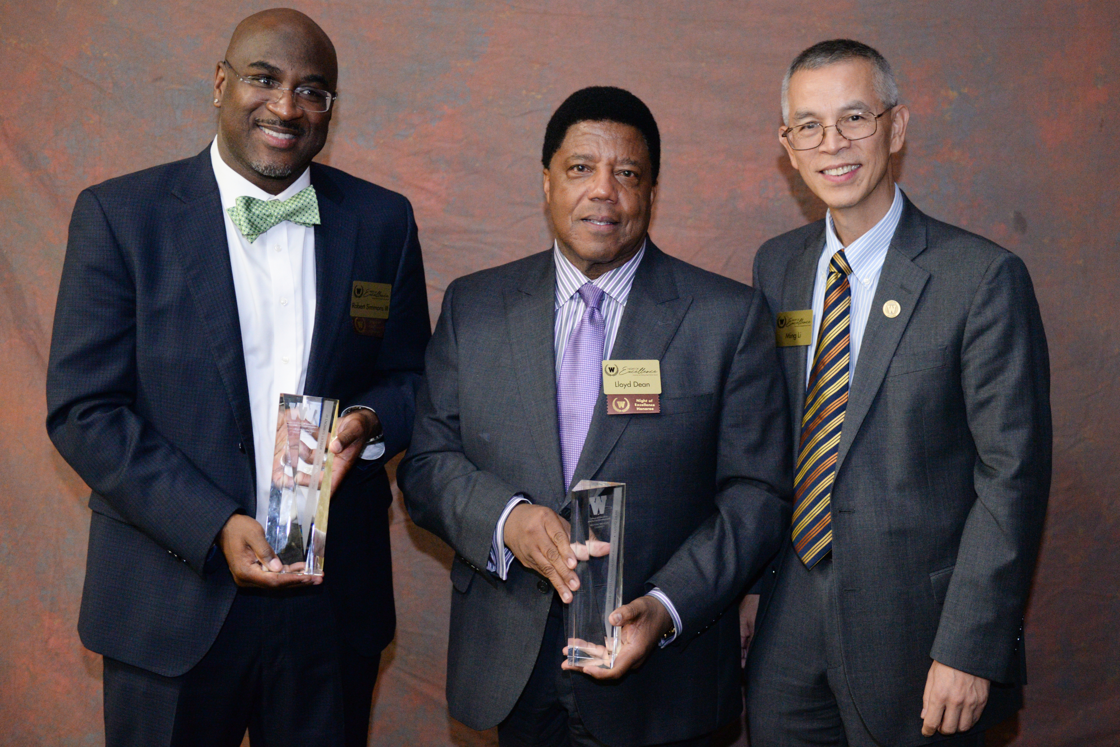 Robert Simmons III, Lloyd Dean and Ming Li with awards