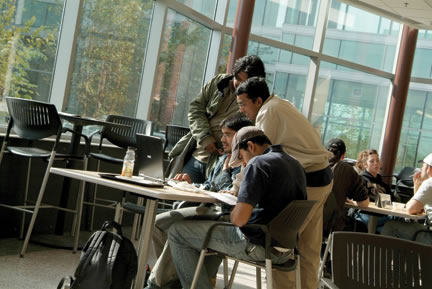 Students studying in an atrium