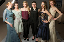 Sarah Lyons poses with models wearing her creations.