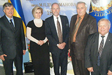 Rick Zinser poses with people from the Ukraine.