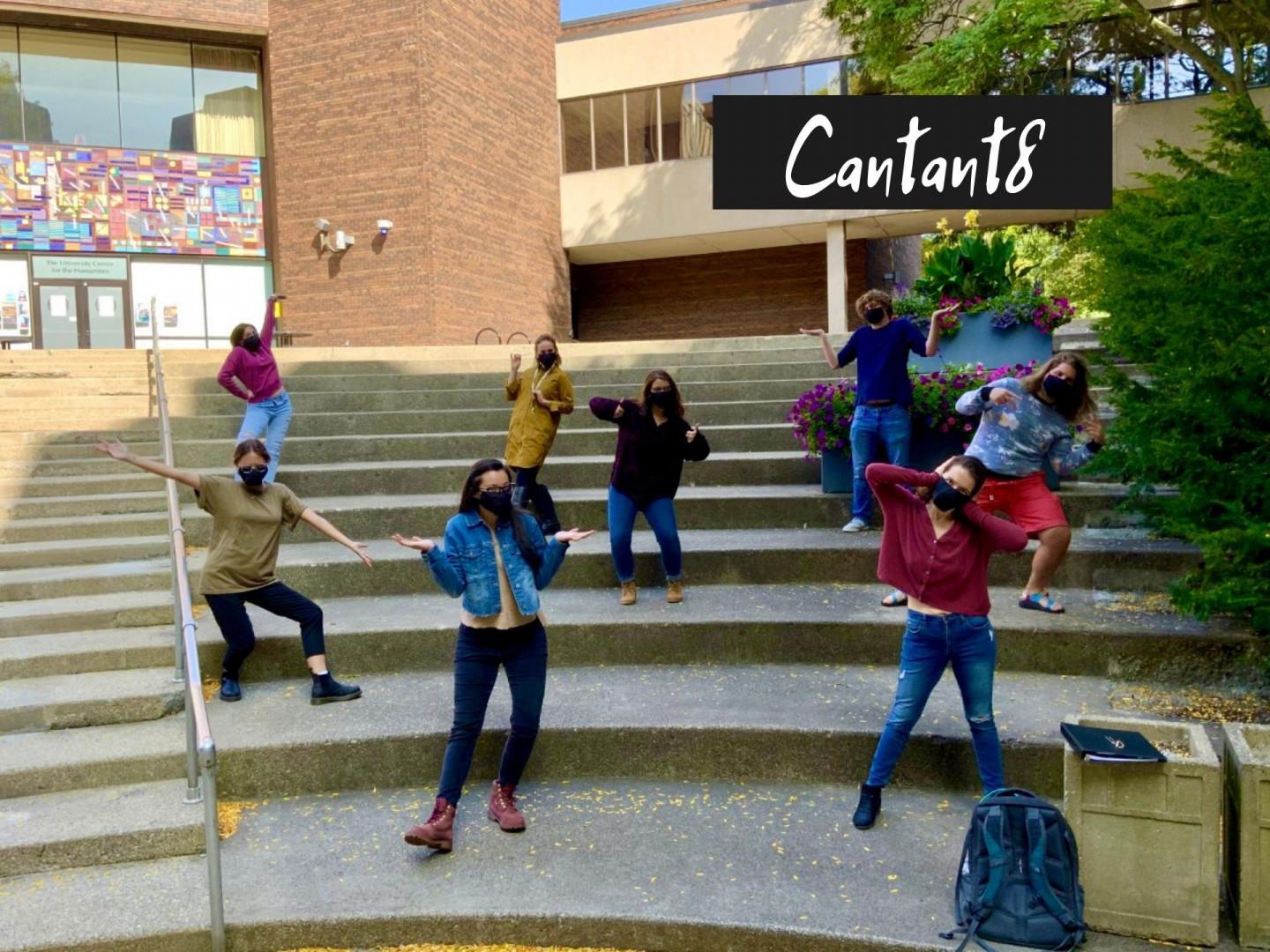 Students pose for a picture on steps on campus.