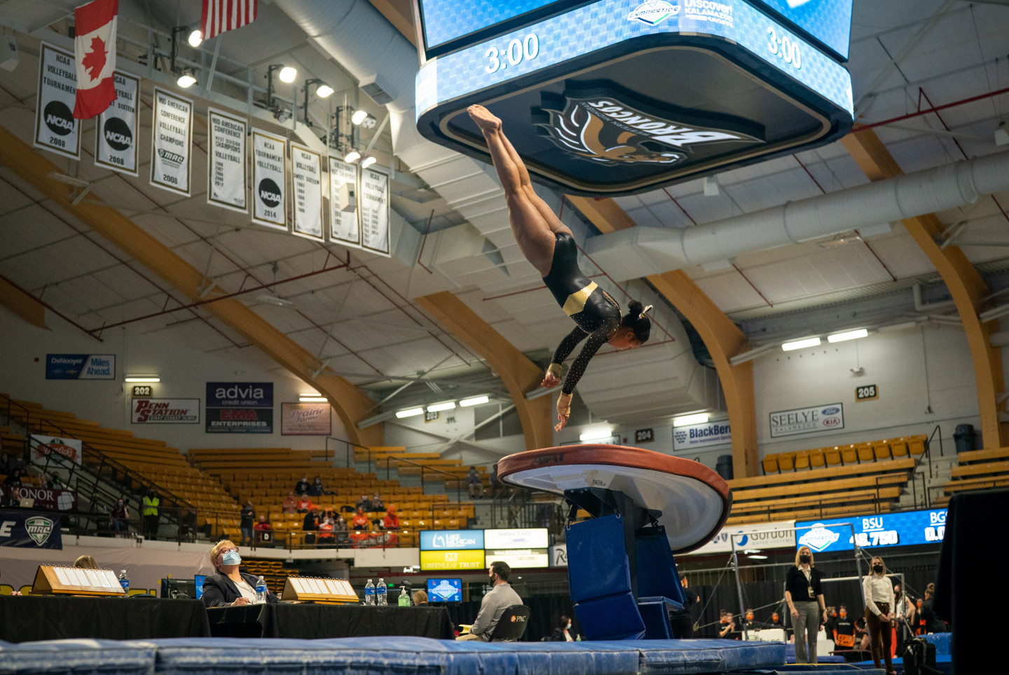 Stacie Harrison flips during a gymnastics competition.