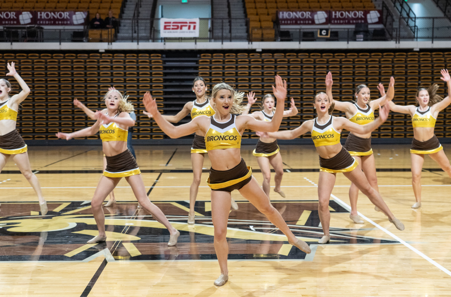 Dance team members perform a routine.