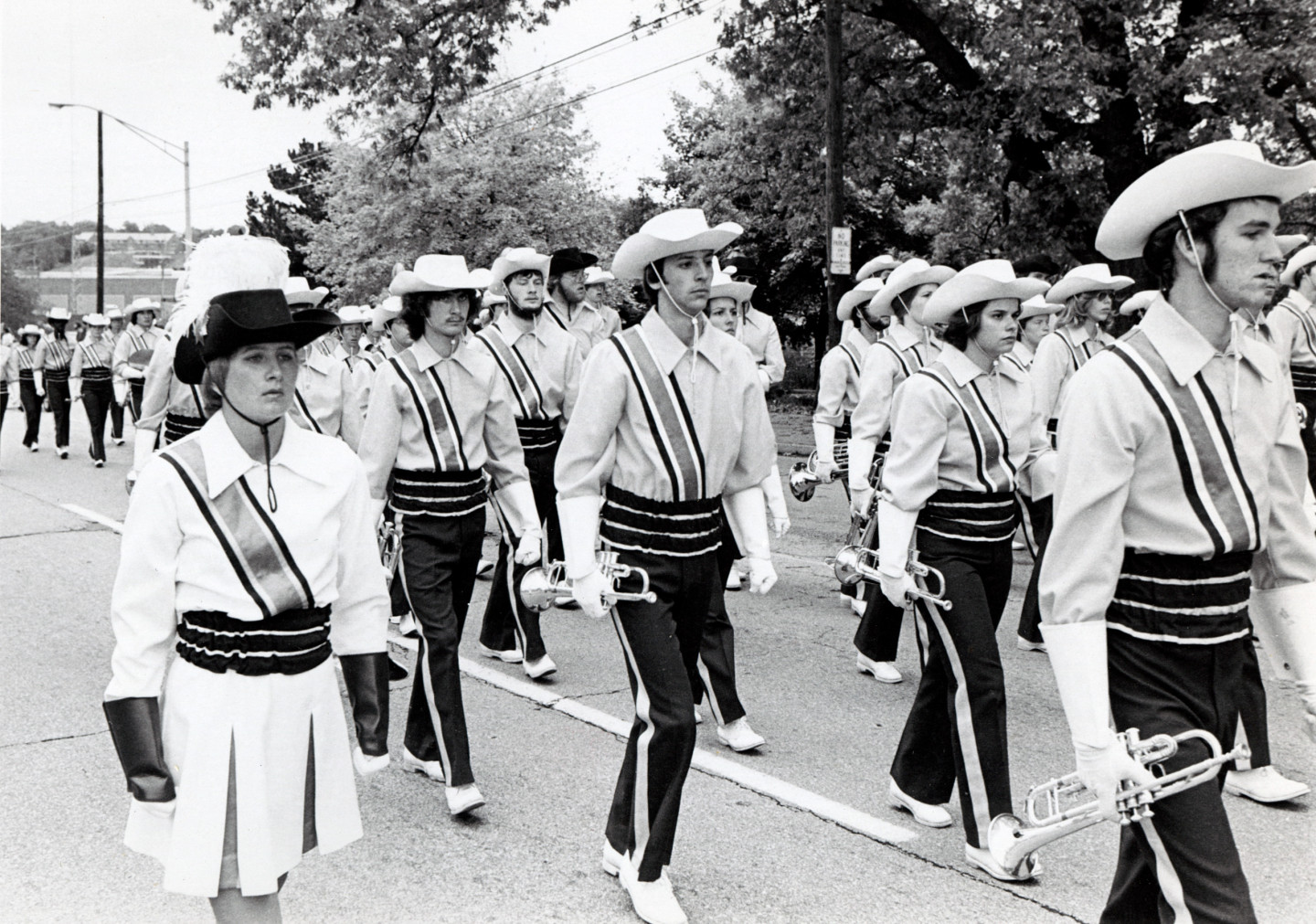 Bronco Marching Band members march in a parade.