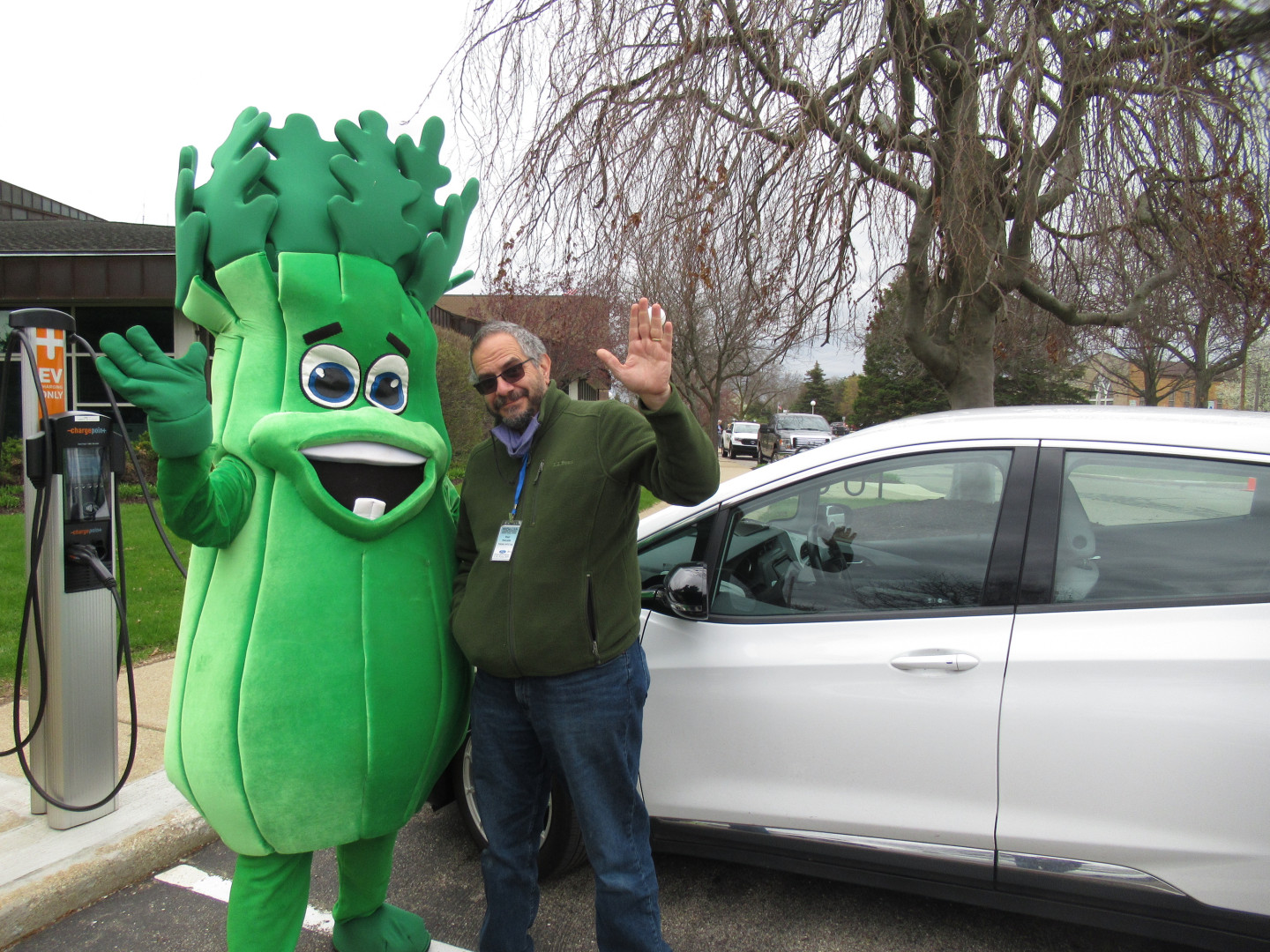 Paul Pancella stands next to a person in a celery mascot costume.