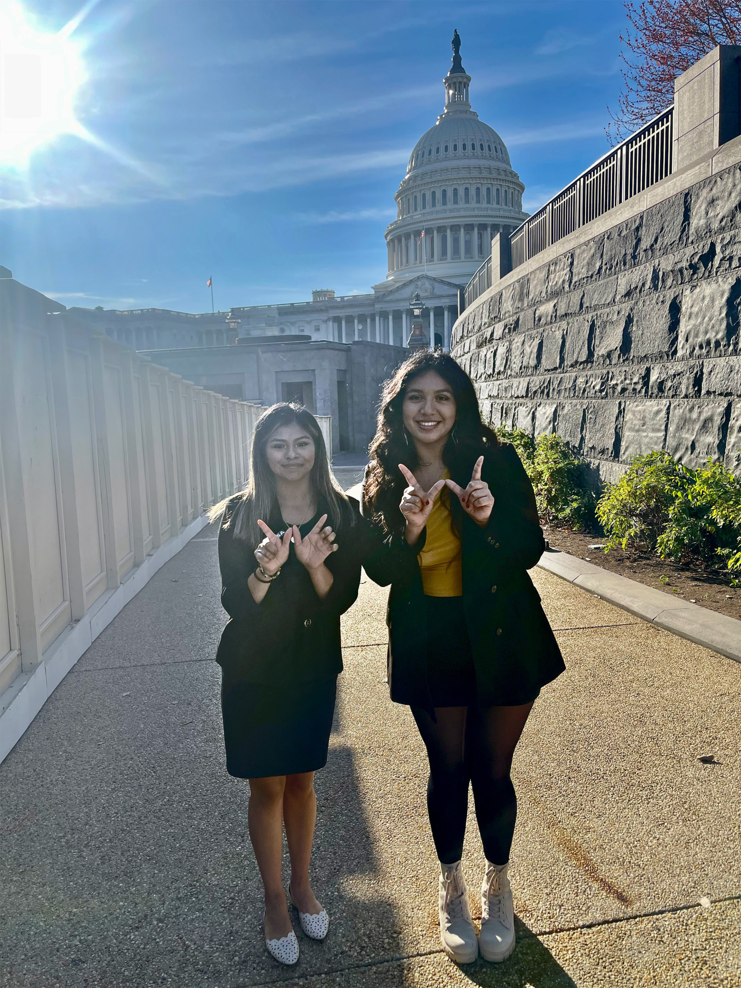 Joana Zuniga and Noemi Mendez pose for a photo in front of the U.S. Capitol.