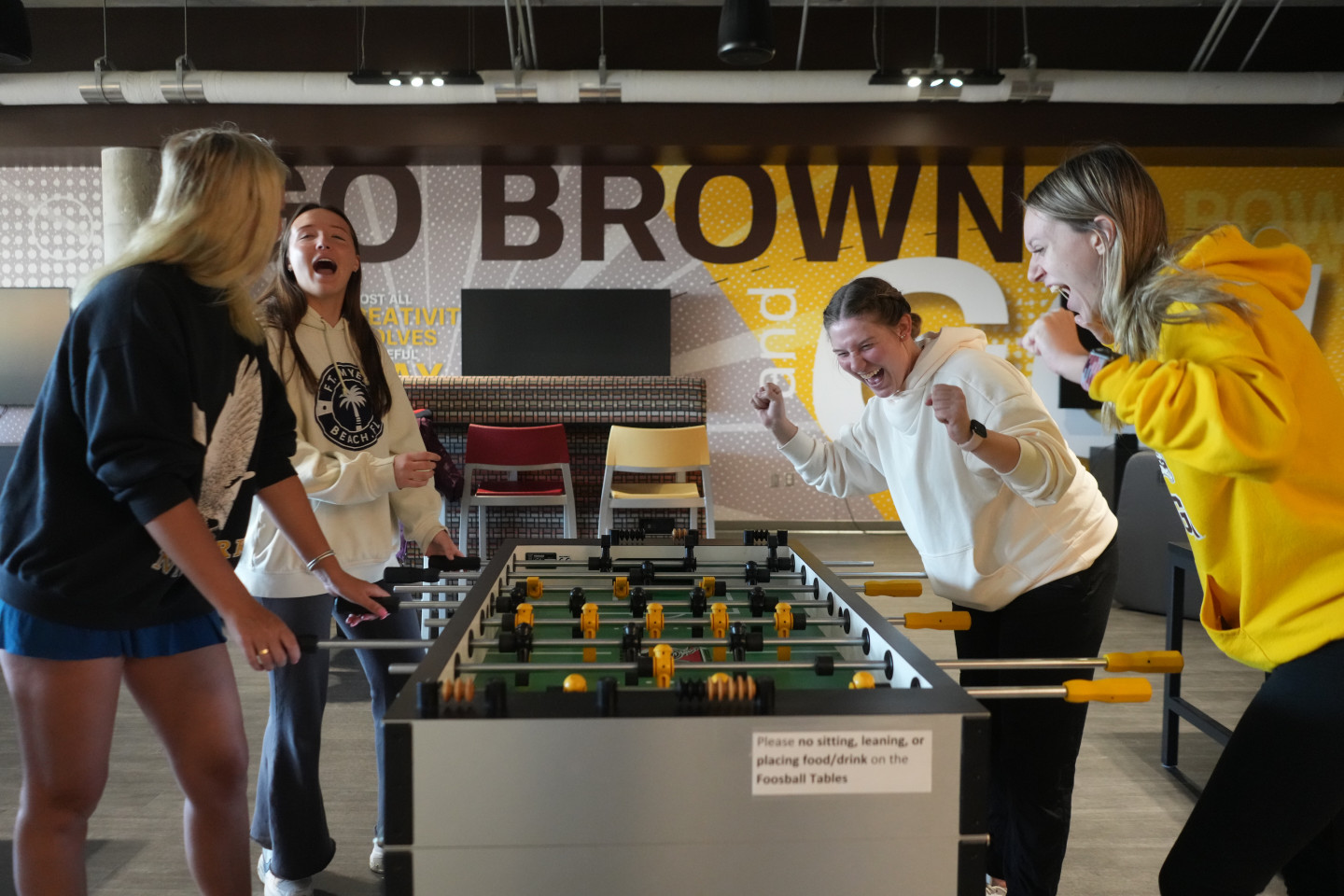 Students playing foosball