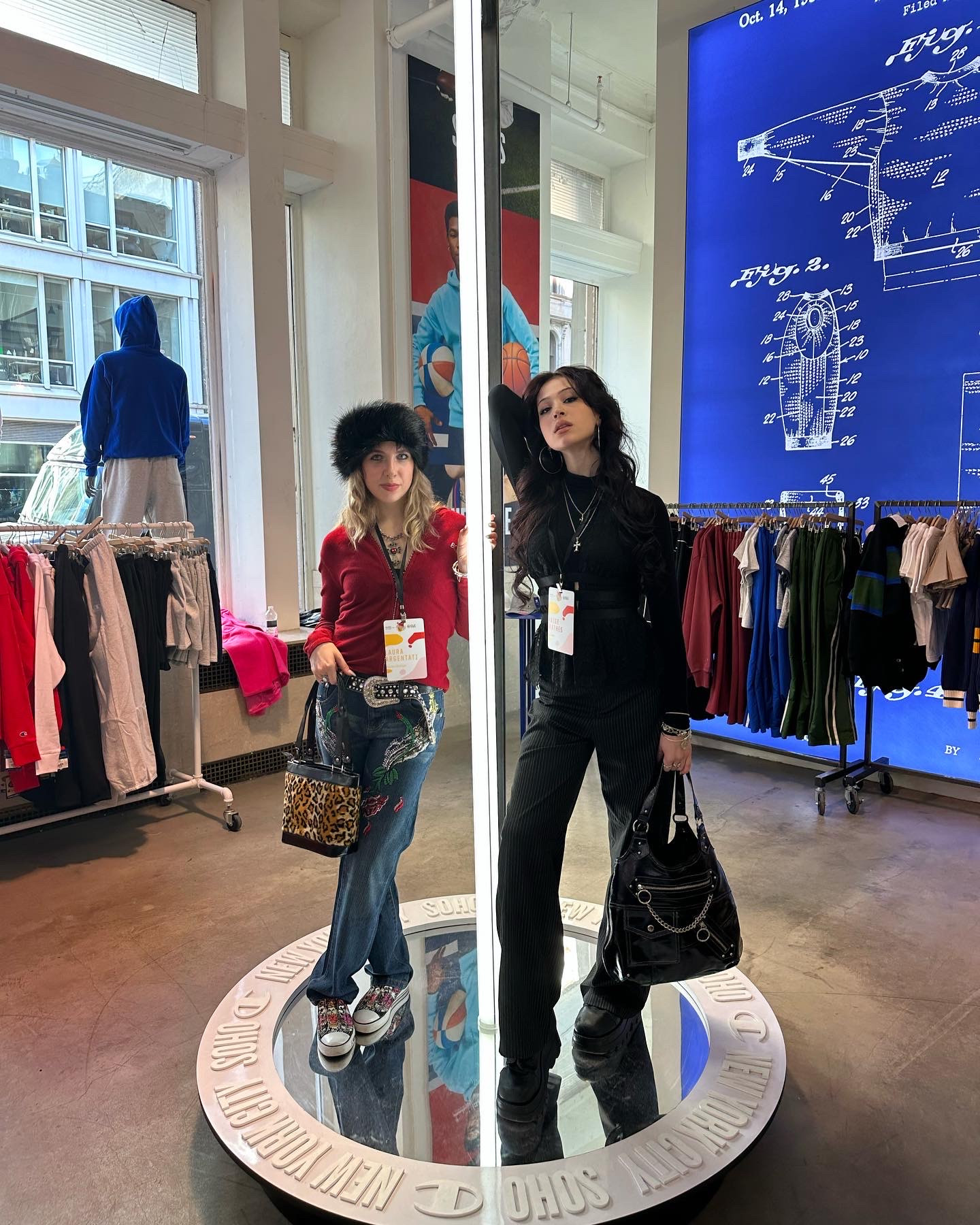 Argentati stands next to another student inside a clothing store.