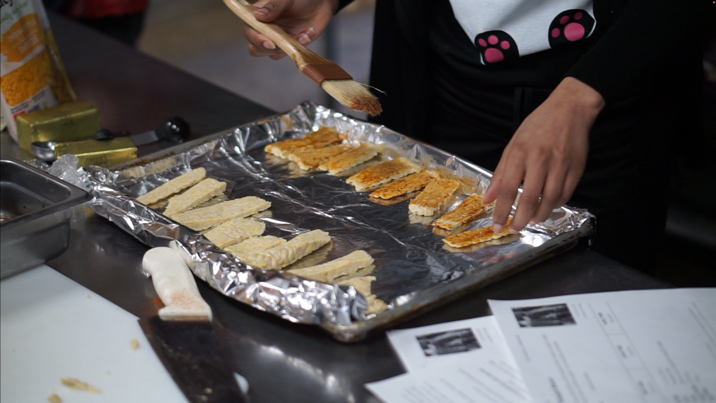 students cook tempeh