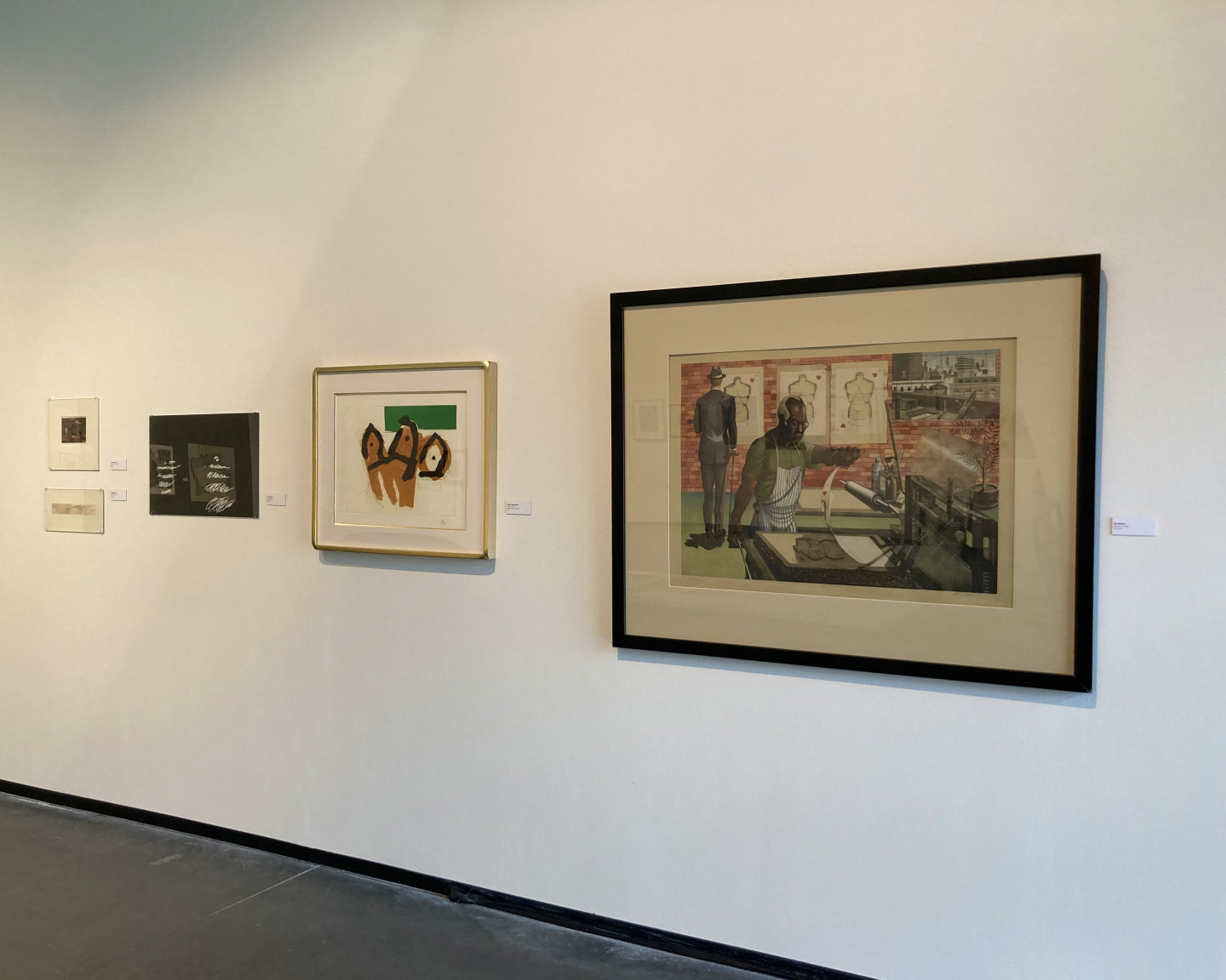 Prominently featured on the right is the print the print “Blackburn” by Ron Adams with a print to its left by Robert Motherwell and another by Cy Twombly.