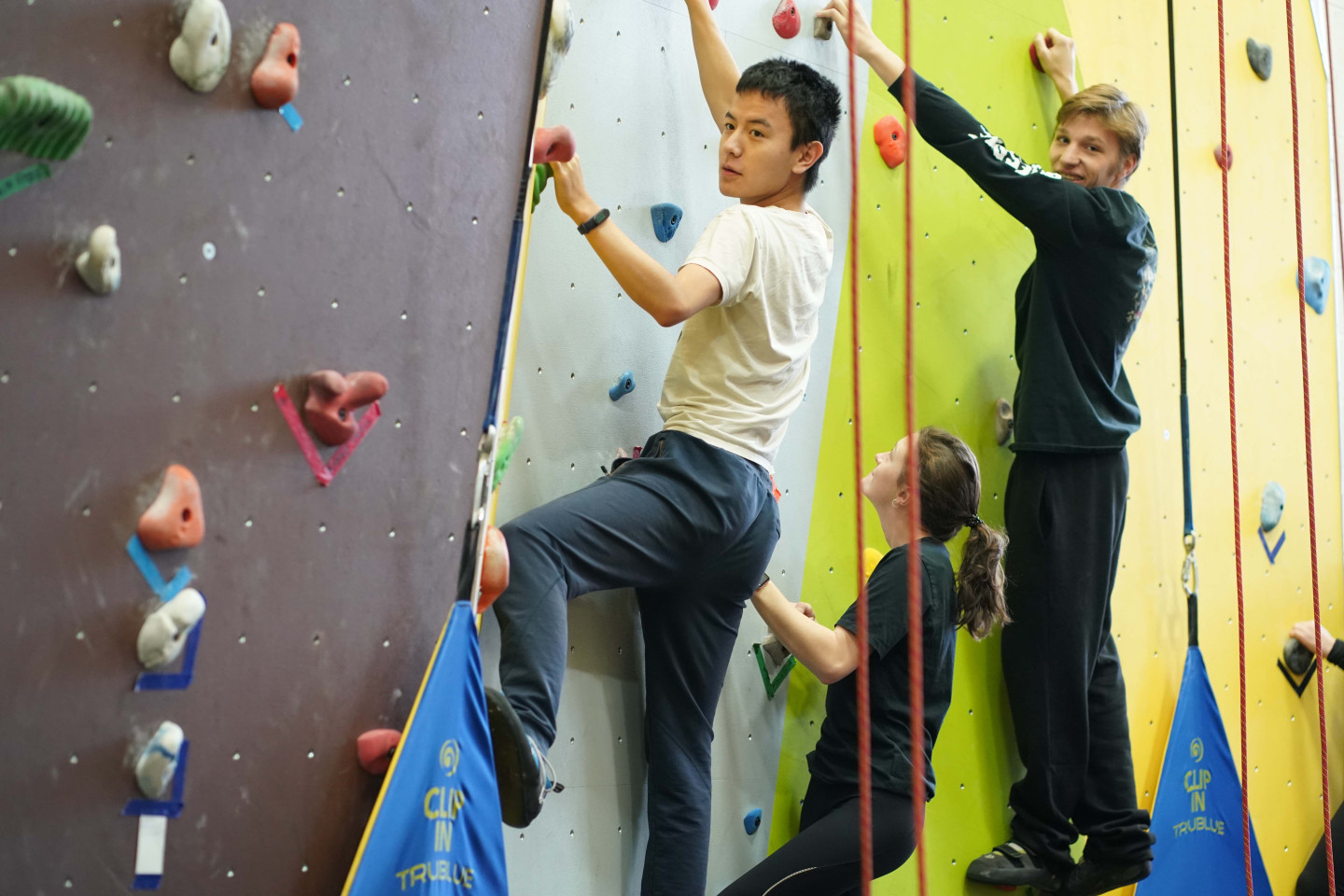 Students climbing the rock wall 