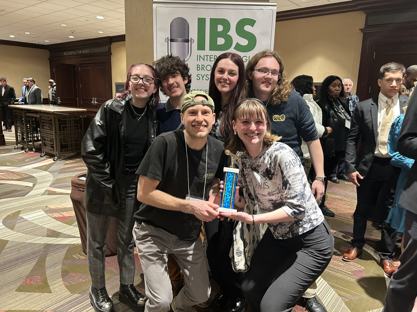 WIDR staff posing with trophy at the IBS Media Awards