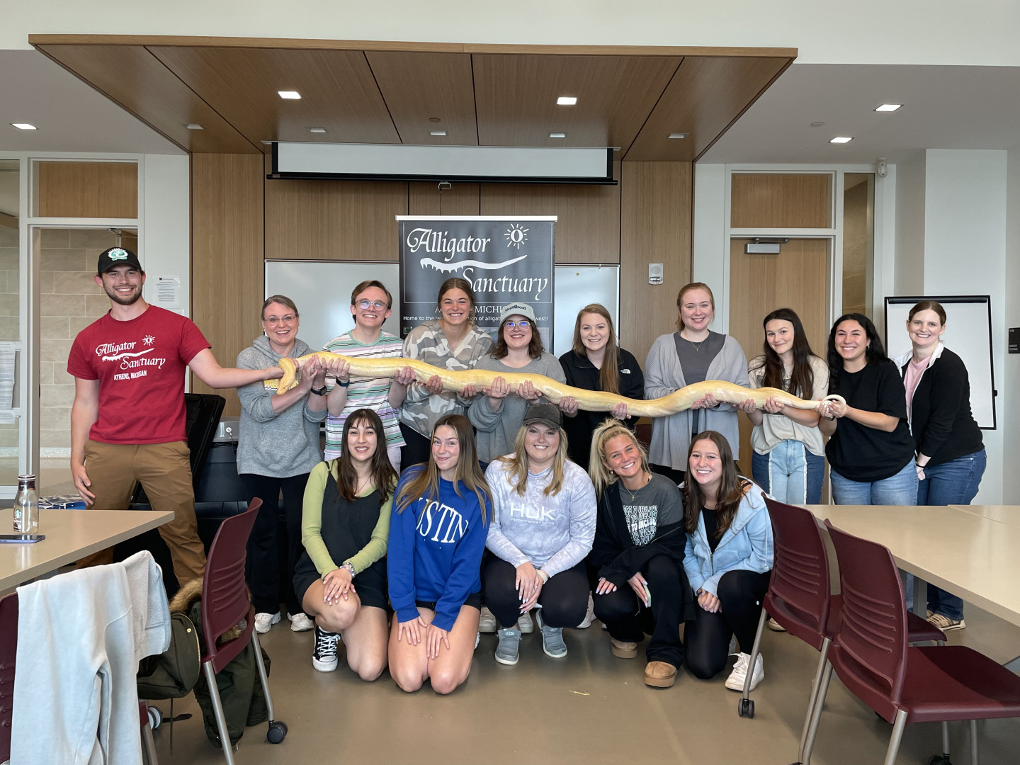 Class of students with snake