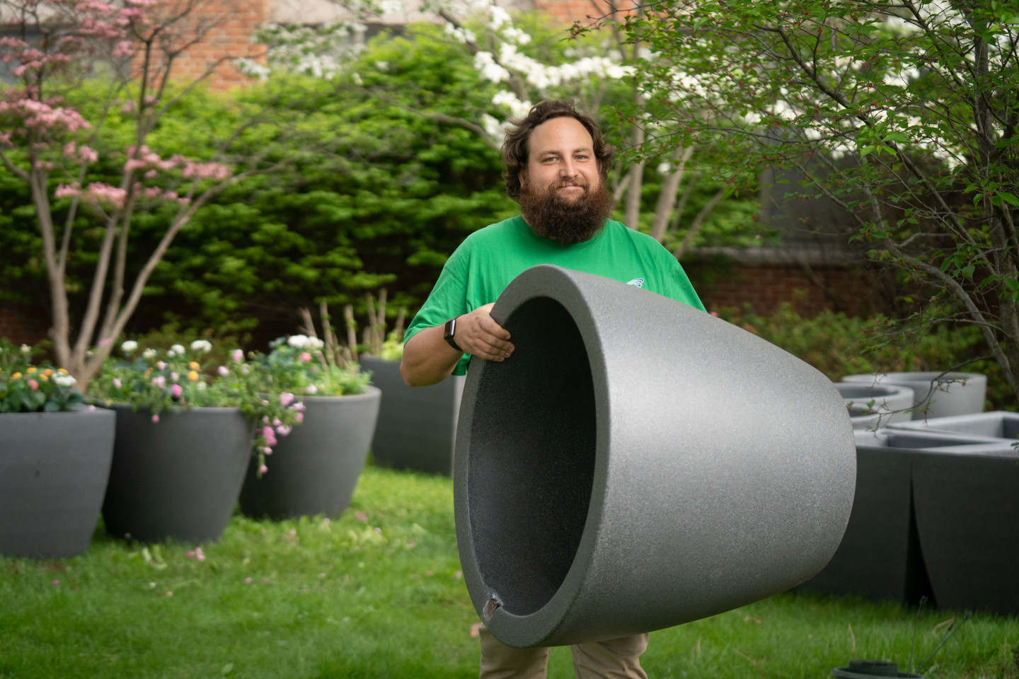 David Prellwitz carries a self-watering planter.