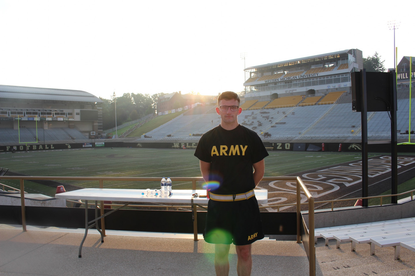 An Army ROTC cadet stands inside Waldo Stadium.