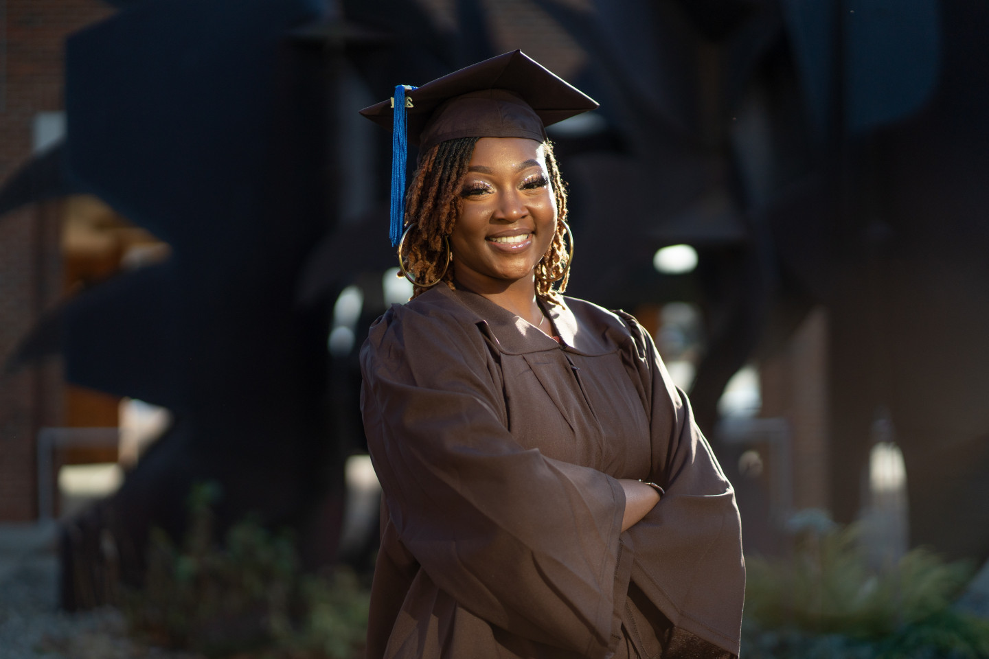 A portrait of Jamilah Anthony in her cap and gown.