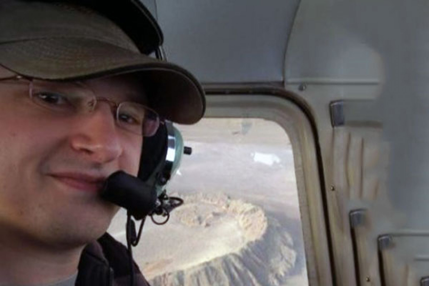 Adam Houtman in aircraft with headset