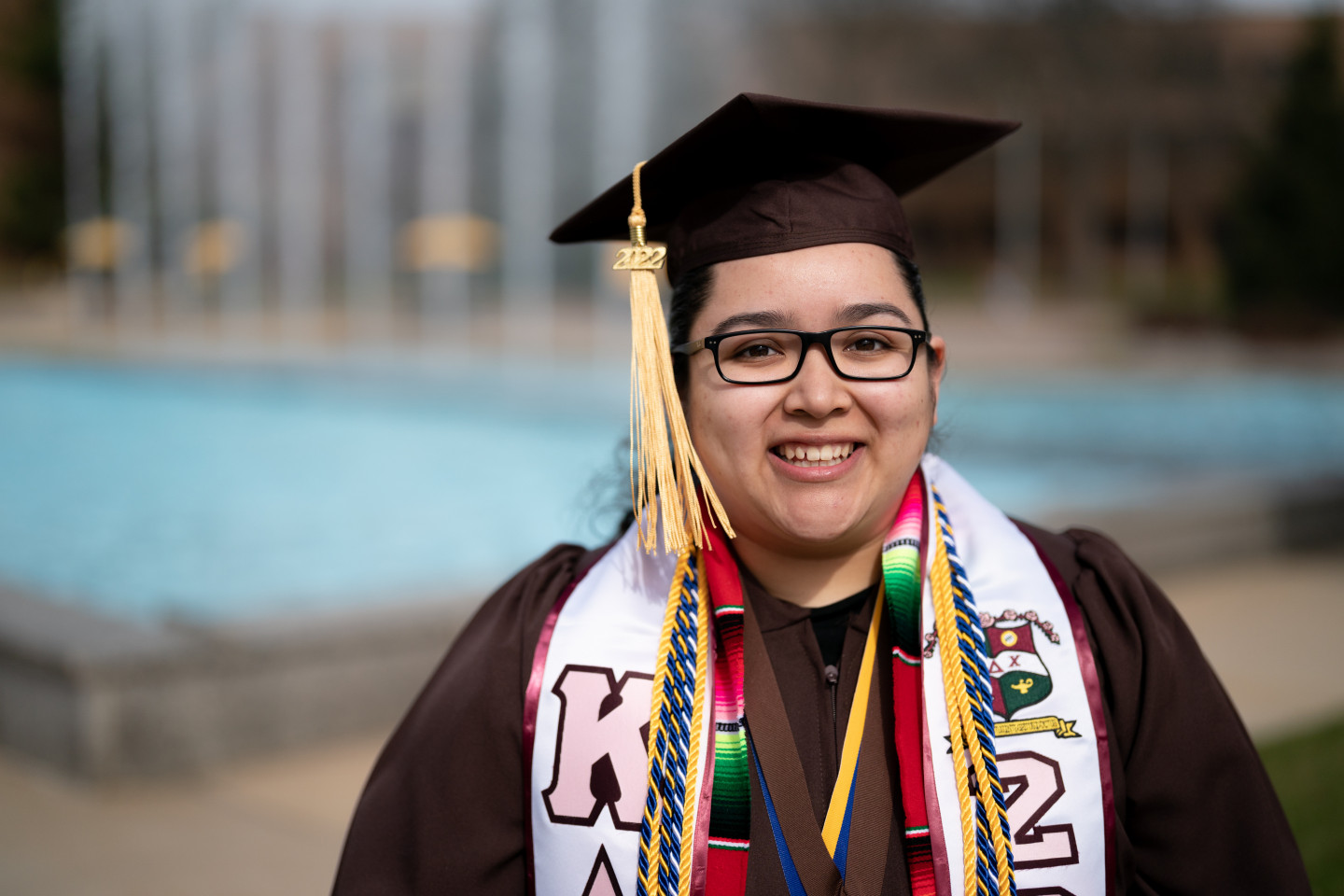 A portrait of Jessica Cortes in her graduation cap and gown.