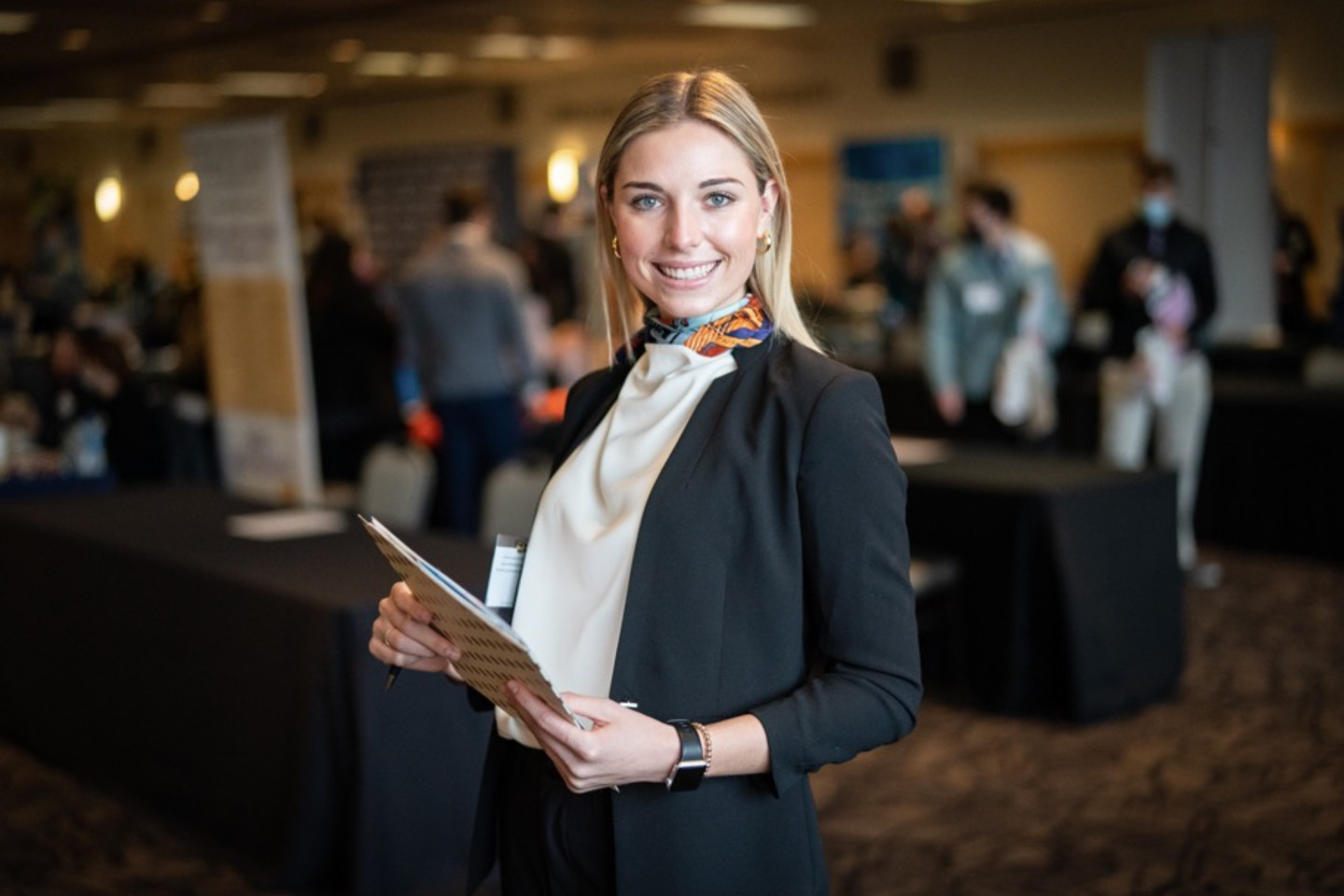 WMU student in business suit at career fair