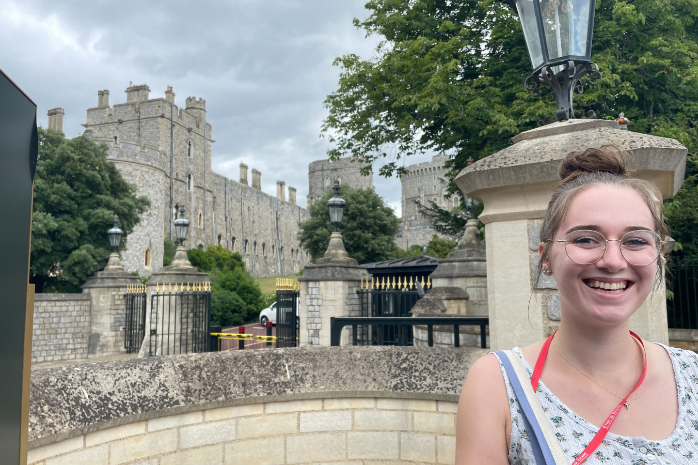 Abbie Lindblade stands in front of a gate at Windsor Castle.