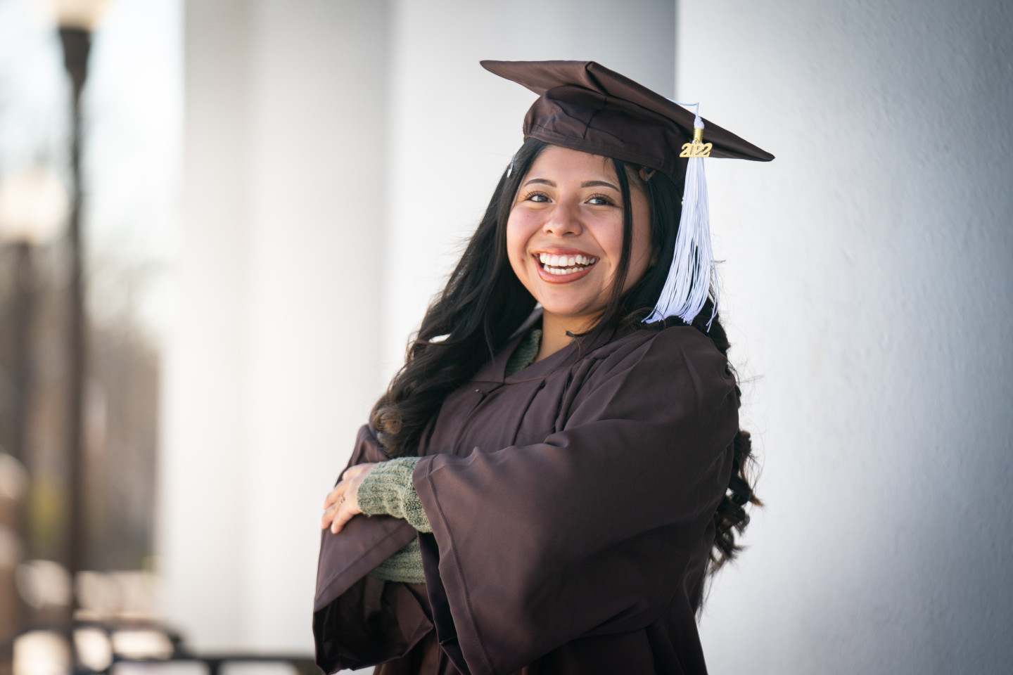 Elizbia Capula poses for a photo in her graduation cap and gown.