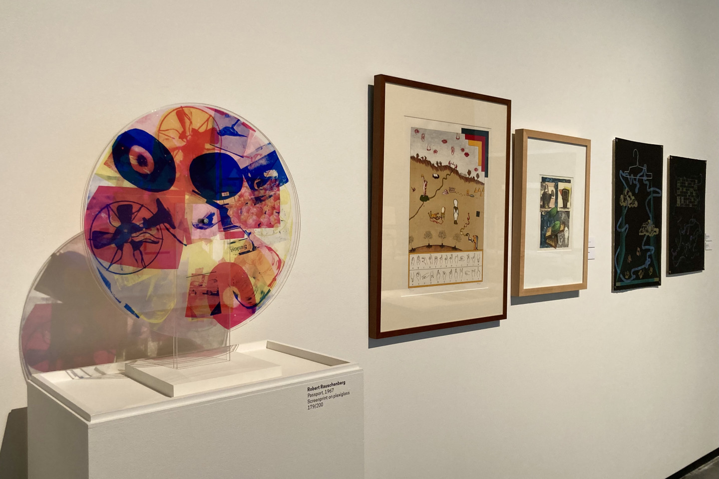The new art exhibit that includes prints "Passport" by Robert Rauschenberg and "Historical Culture by Jan Voss.