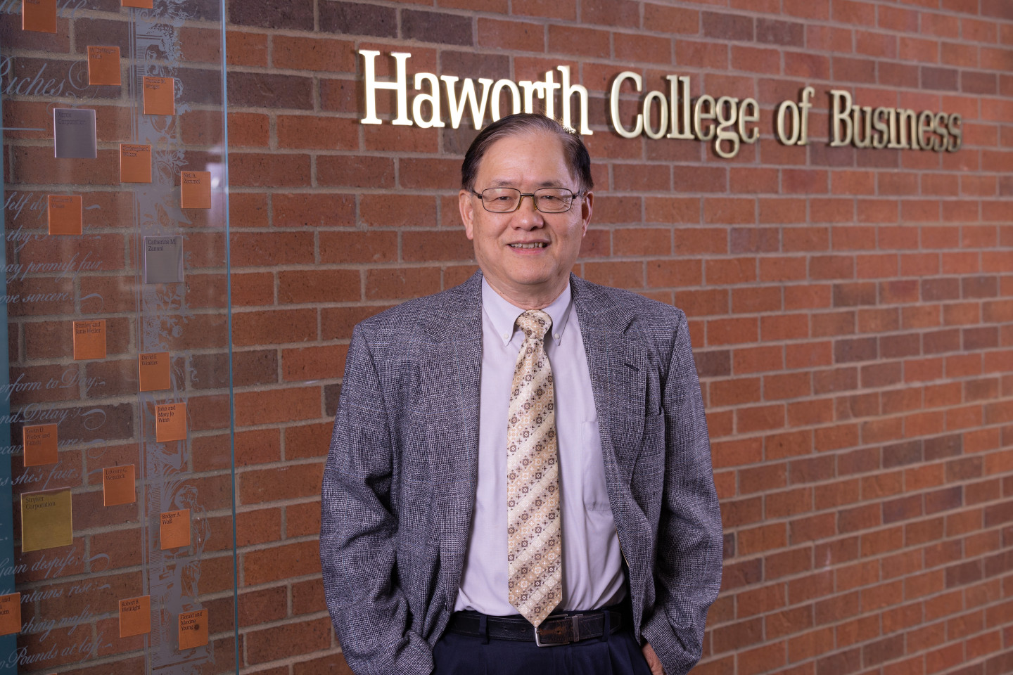 Dr. Bernard Han stands in the lobby of the Haworth College of Business