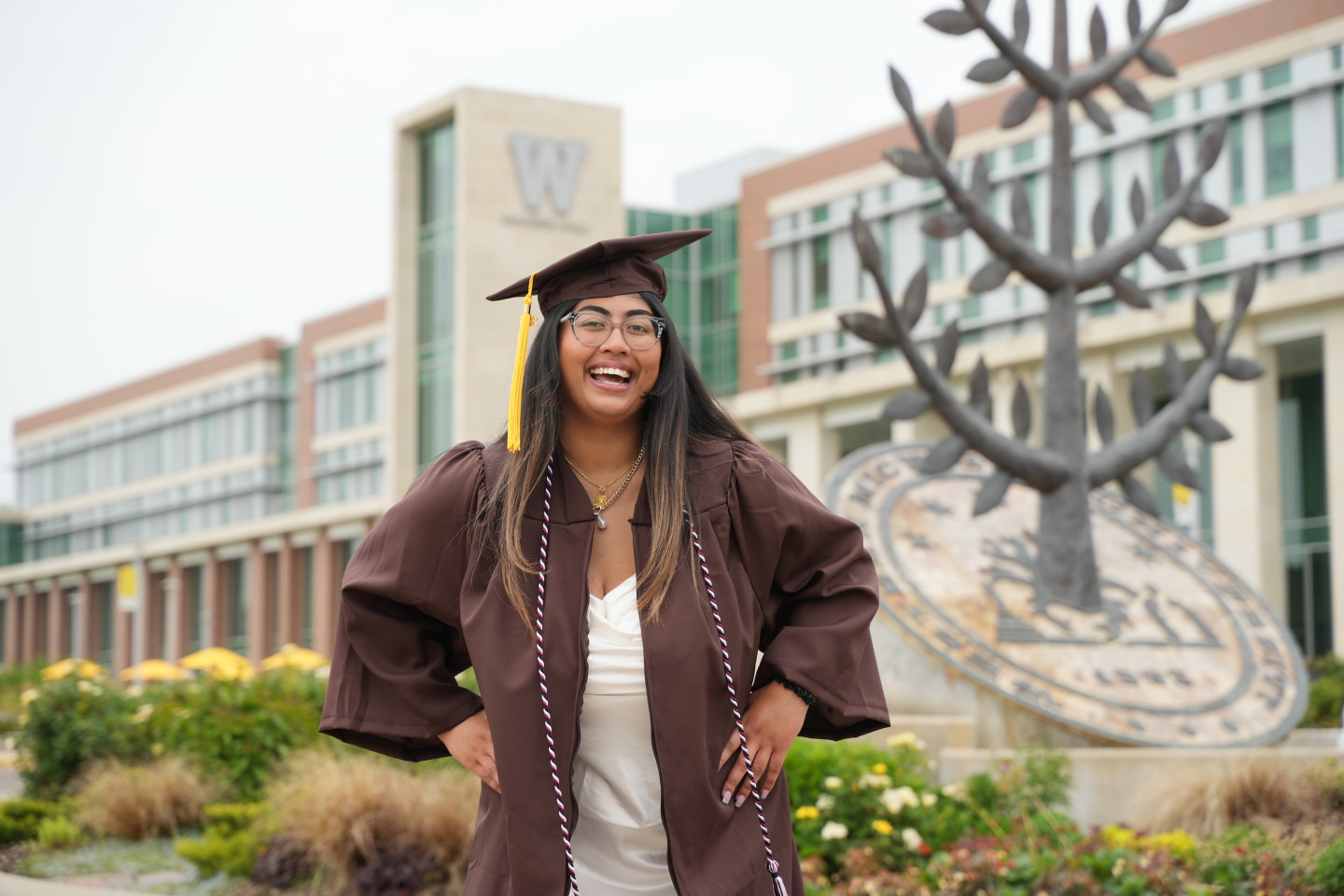 Warda Niaz poses for a photo in her cap and gown.