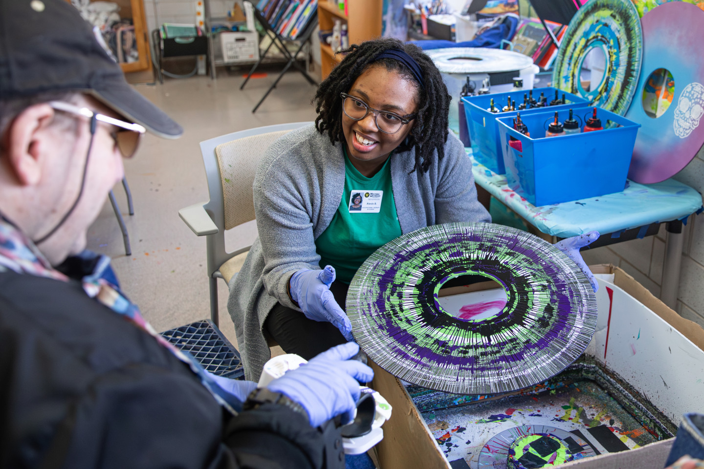 Occupational therapy doctoral student Alexis Bailey works on a project with participants from the Center for Disability Services 
