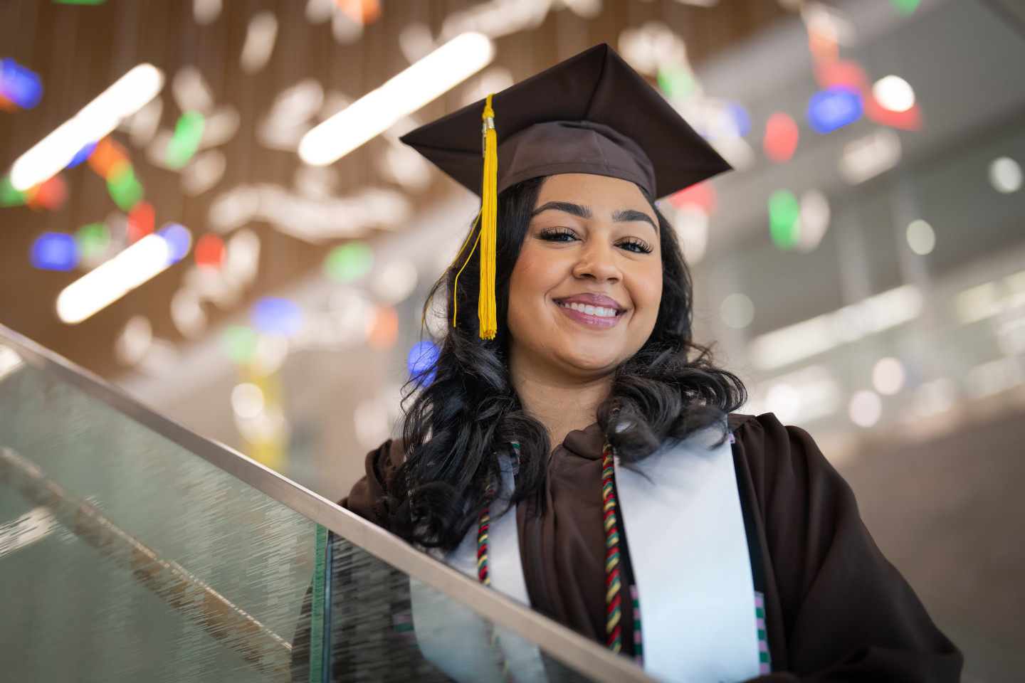 A portrait of Breyana Wilson in her graduation cap and gown.