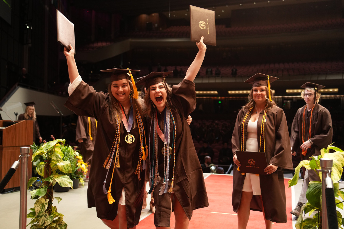 Students in their graduation caps and gowns.