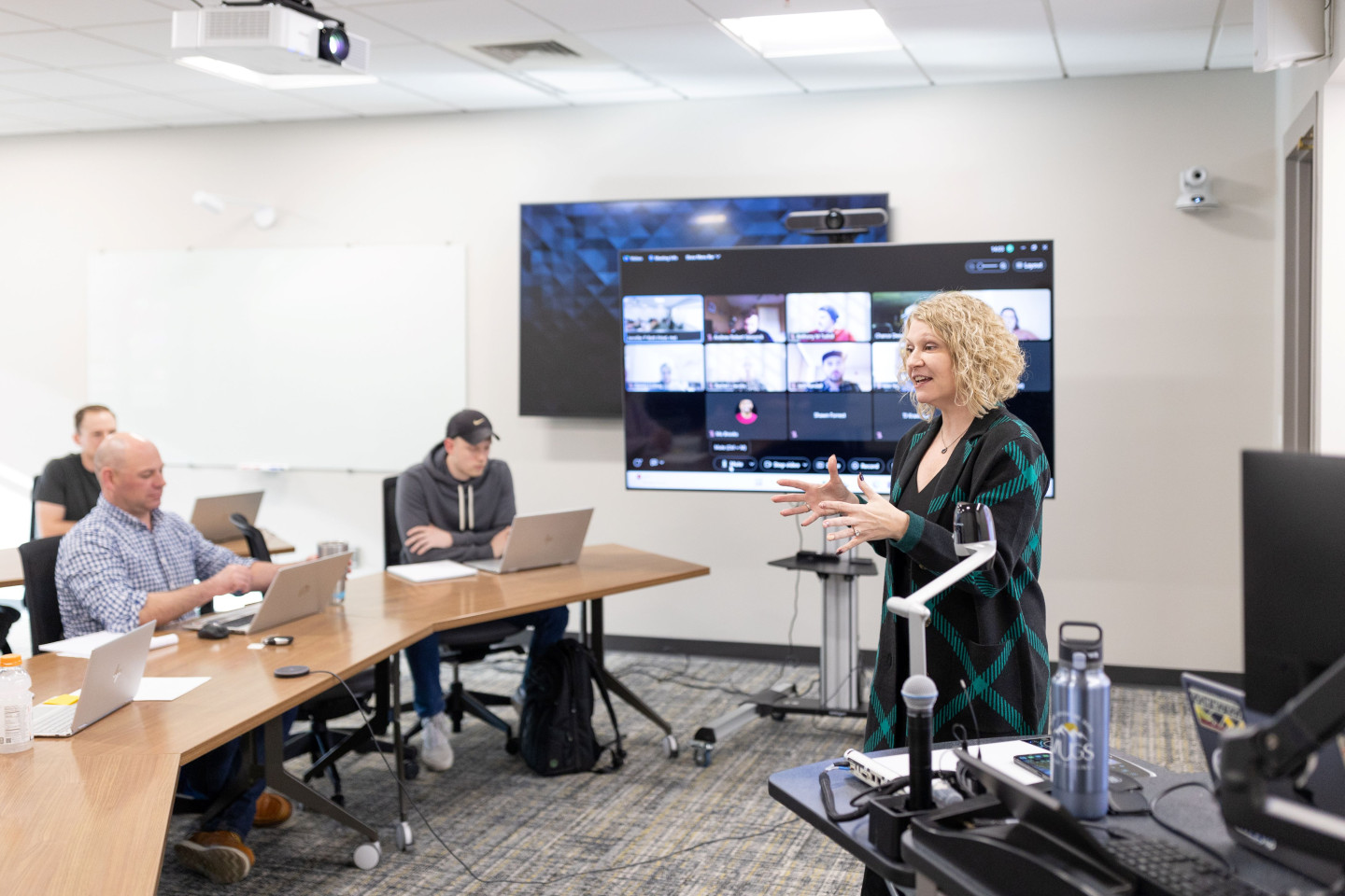Dr. Jennifer Bott teaches a course with students attending online and in person