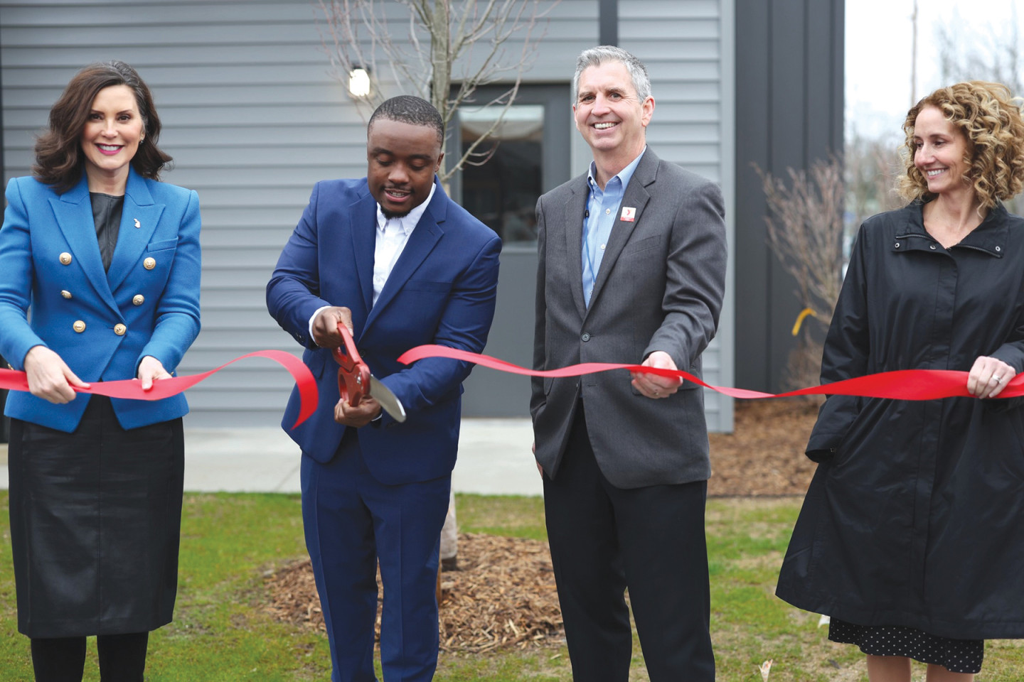 Left to right, Gov. Gretchen Whitmer, Jamauri Bogan, YMCA of Greater Kalamazoo CEO David Morgan and Amy Hovey, executive director and CEO of the Michigan State Housing Development Authority. (Photo courtesy of State of Michigan)