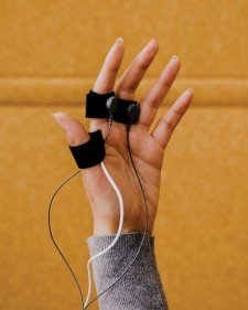 image of a hand wearing sensory equipment hooked to wires