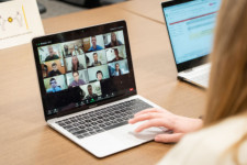 photo of laptop with multiple students on video chat