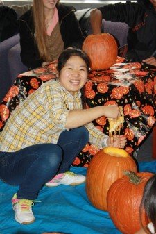 CELCIS student, Ran Wei, carving pumpkin