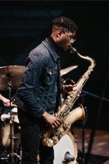 Eddie Codrington plays the saxophone.